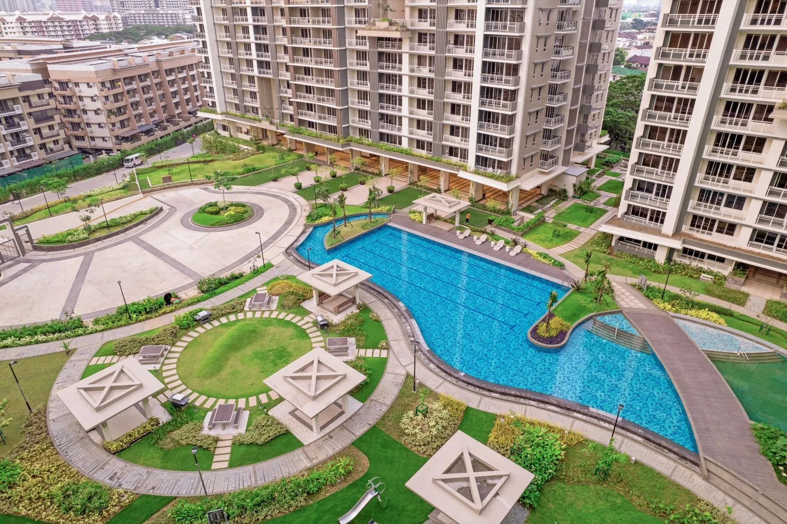 The resort pool and gardens at Alder Residences, Acacia Estates, Taguig