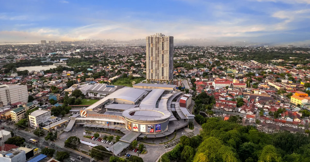 Aerial view of Robinsons Place Las Pi&ntilde;as with Sonora Garden Residences behind it — the integrated mall-and-residential site